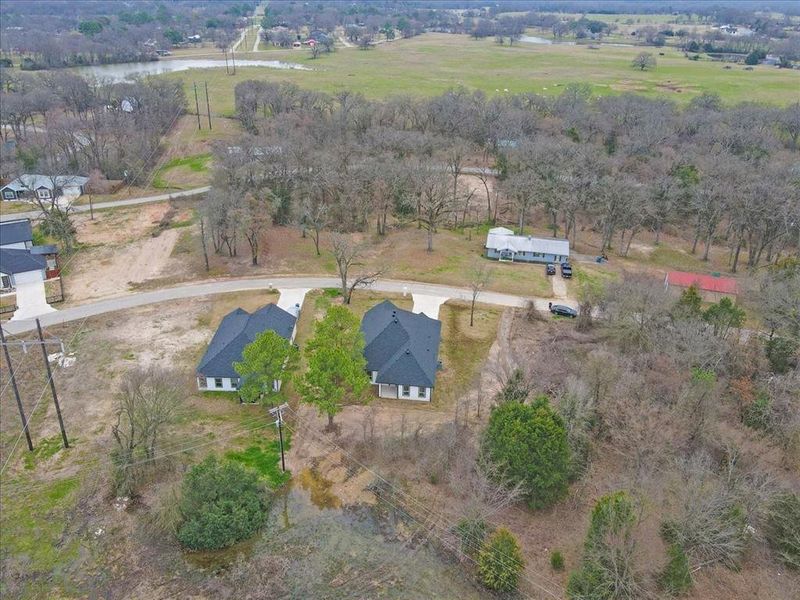 Drone / aerial view with a water view and a rural view