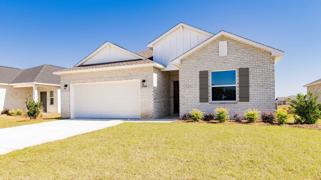 Front exterior of a new home in Oakstone Farms, Leesburg, FL, highlighting curb appeal (Image 28).