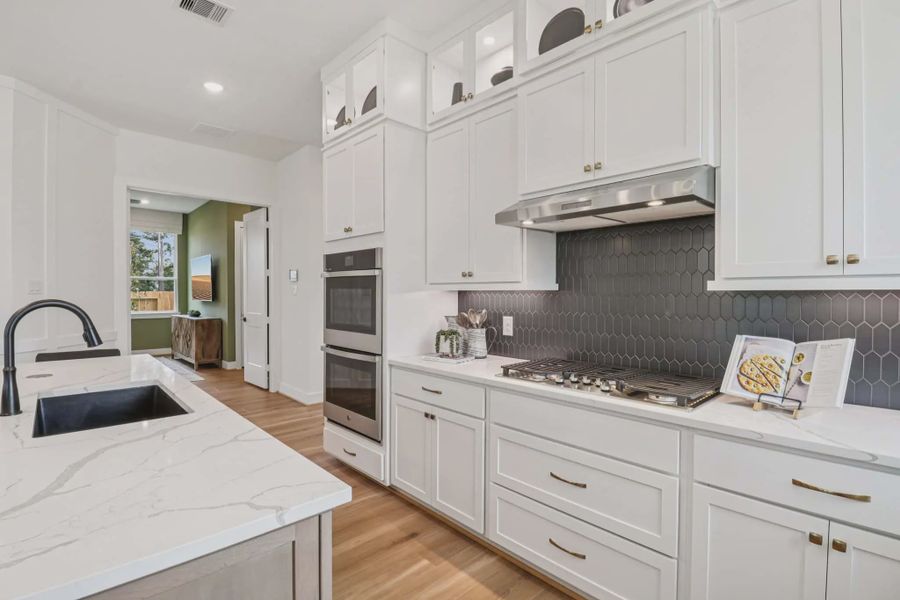 Representative furnished interior of a home built from the Lauren by Chesmar Homes in Grange, Katy (Image 8).