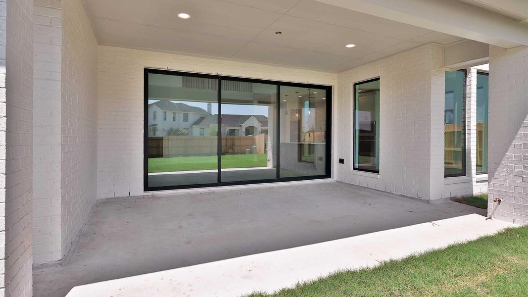Exterior details and patio area of a home in Lakes of Cane Island, Katy (Image 2).