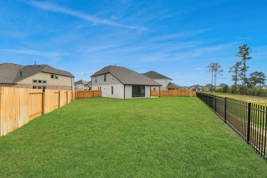 Backyard retreat, offering an abundance of space for kids to play and explore. The possibilities are endless in this outdoor haven, where the joy of open-air activities and family gatherings awaits. Backyard retreat, offering an abundance of space for kids to play and explore. The possibilities are endless in this outdoor haven, where the joy of open-air activities and family gatherings awaits.