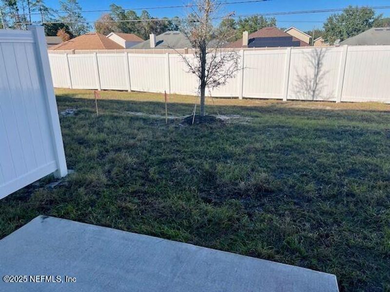 Exterior details and patio area of a home in The Landing, Middleburg (Image 2).