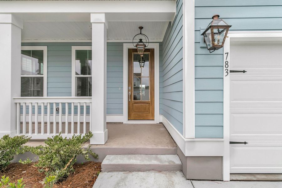 Exterior details and patio area of a home in Tidewater at Lakes of Cane Bay, Summerville (Image 2). Exterior details and patio area of a home in Tidewater at Lakes of Cane Bay, Summerville (Image 2).