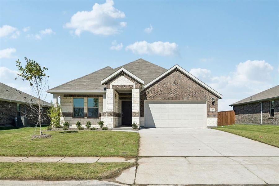 Front exterior of a new home in River Ridge, Crandall, TX, highlighting curb appeal (Image 2). Front exterior of a new home in River Ridge, Crandall, TX, highlighting curb appeal (Image 2).