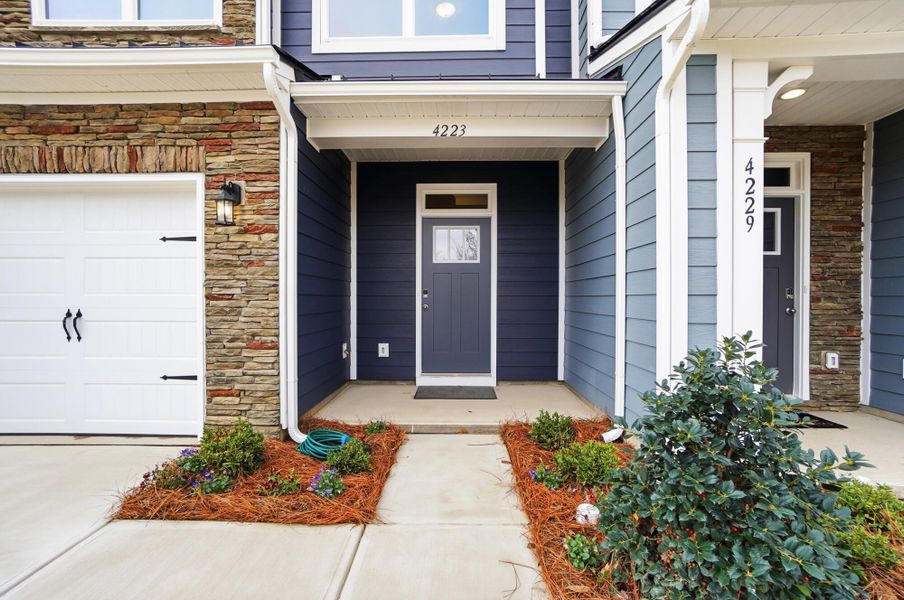 Exterior details and patio area of a home in Harrisburg Village Townhomes, Harrisburg (Image 4).