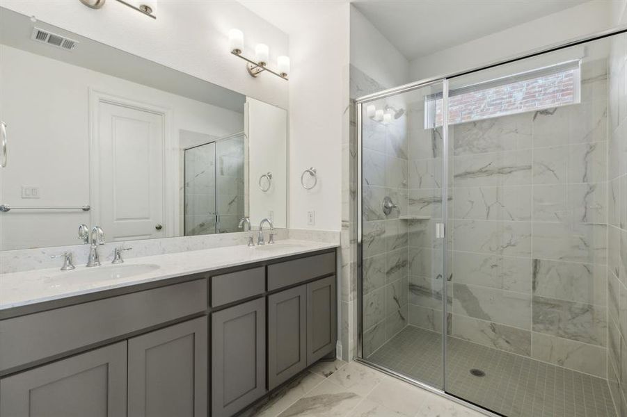 Bathroom with vanity and walk in shower