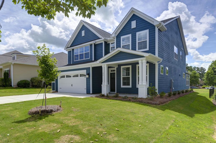 Front exterior of a new home in Cobblestone Park, Blythewood, SC, highlighting curb appeal (Image 2). Front exterior of a new home in Cobblestone Park, Blythewood, SC, highlighting curb appeal (Image 2).