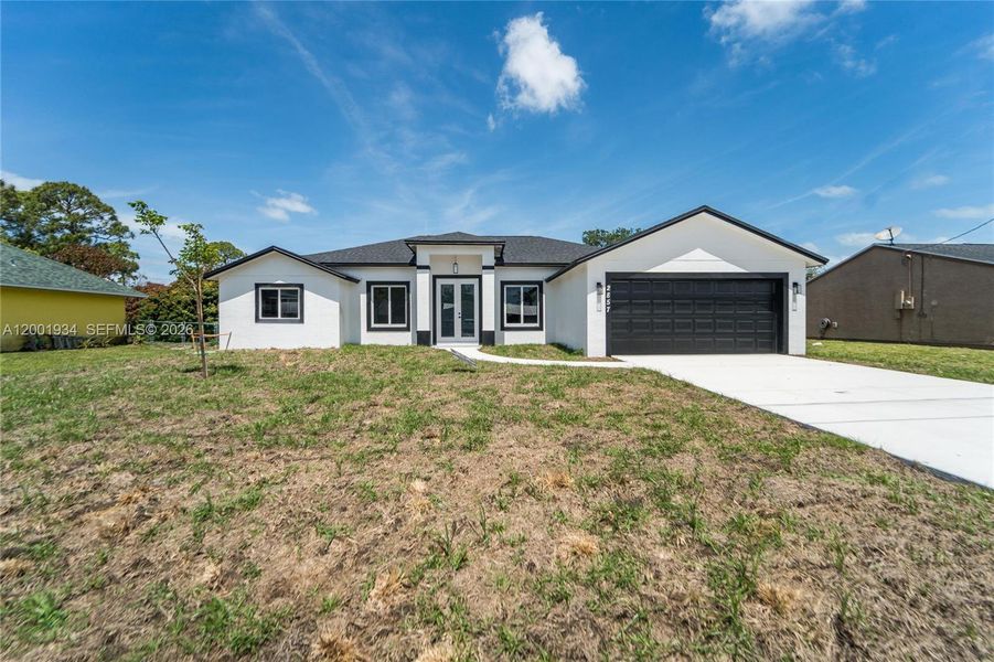 Front exterior of a new home in , Port St. Lucie, FL, highlighting curb appeal (Image 20).