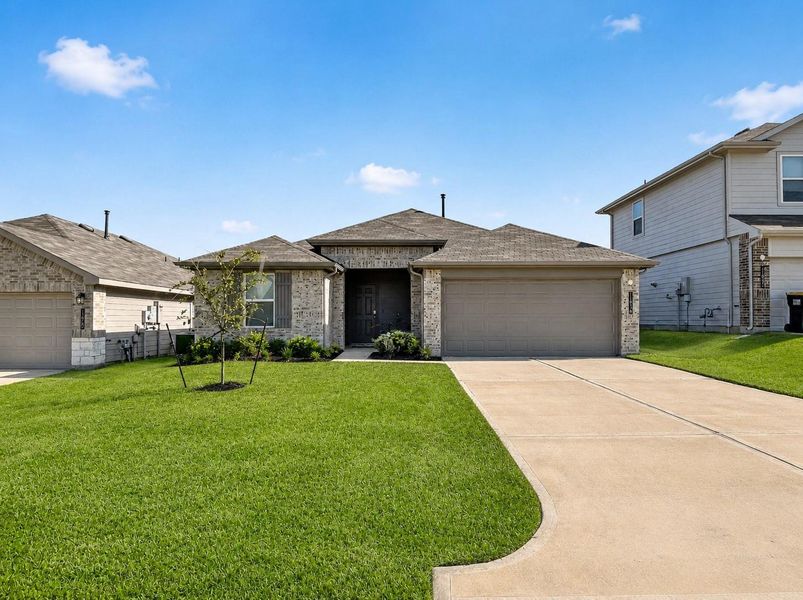 Front exterior of a new home in Summerwood Trails, Willis, TX, highlighting curb appeal (Image 2). Front exterior of a new home in Summerwood Trails, Willis, TX, highlighting curb appeal (Image 2).