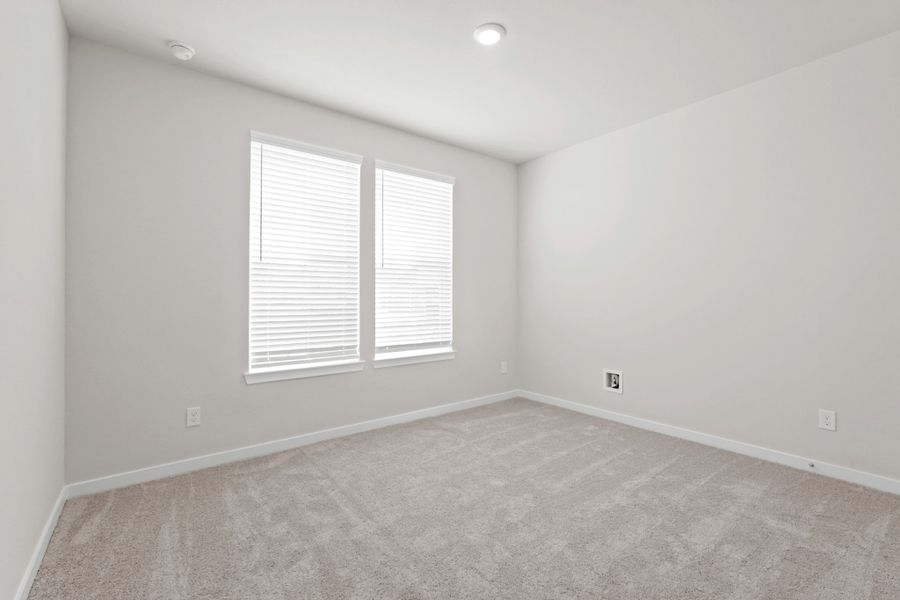 A room with a carpet and a window. A room with a carpet and a window.