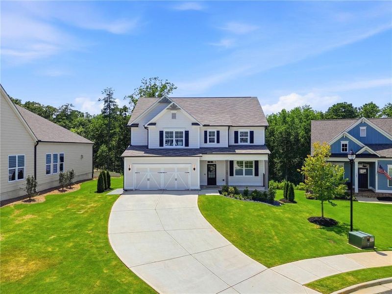 Front exterior of a new home in , Woodstock, GA, highlighting curb appeal (Image 25). Front exterior of a new home in , Woodstock, GA, highlighting curb appeal (Image 25).
