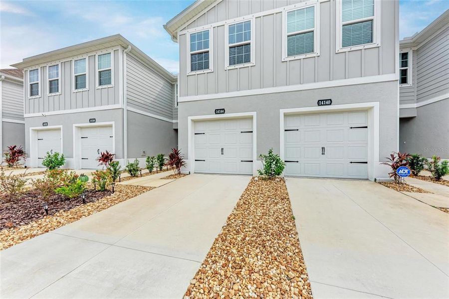 Front exterior of a new home in , Bradenton, FL, highlighting curb appeal (Image 25).