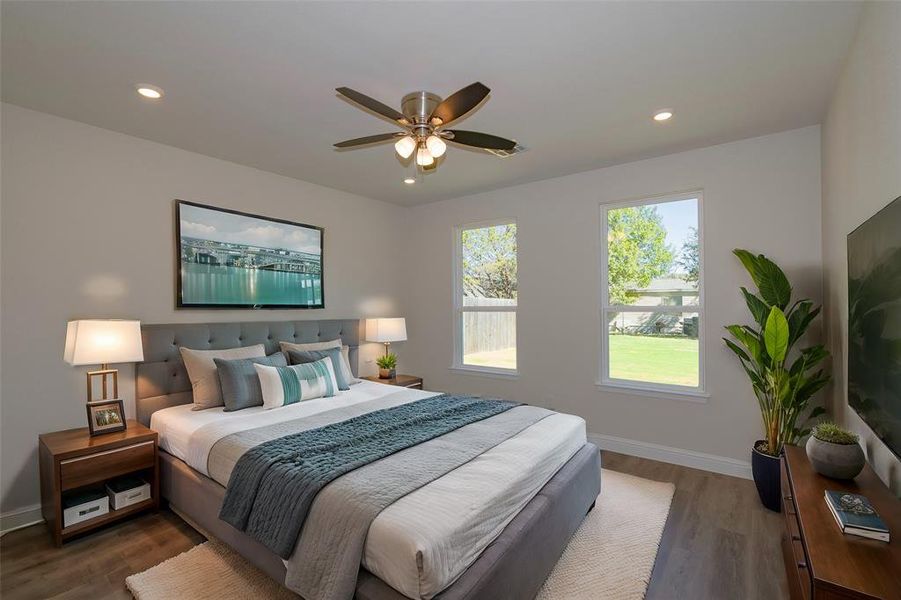 Bedroom featuring ceiling fan and dark hardwood / wood-style floors