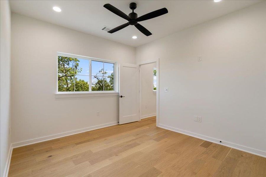 Unfurnished room with light wood-type flooring, recessed lighting, and ceiling fan