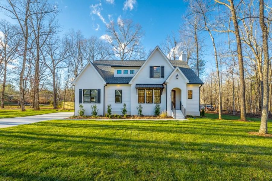 Representative exterior photo of a completed home built from the Carolina A by Riverstone Construction, LLC in Jasper Highlands, Guild, TN (Image 2).