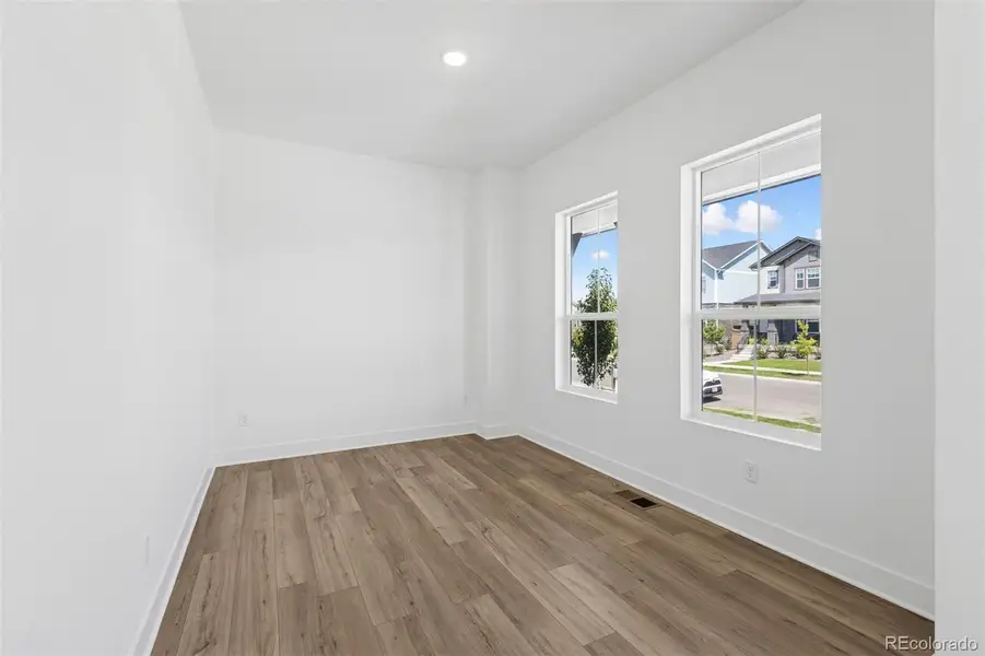 Spacious, unfurnished interior of a new home in Painted Prairie Cottage, Aurora (Image 31).