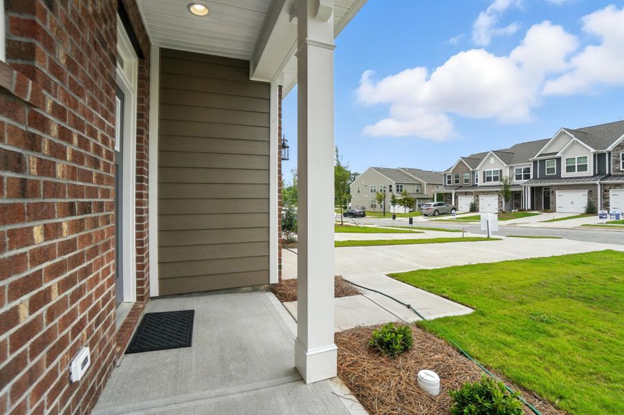 Front exterior of a new home in Harrisburg Village Townhomes, Harrisburg, NC, highlighting curb appeal (Image 29). Front exterior of a new home in Harrisburg Village Townhomes, Harrisburg, NC, highlighting curb appeal (Image 29).