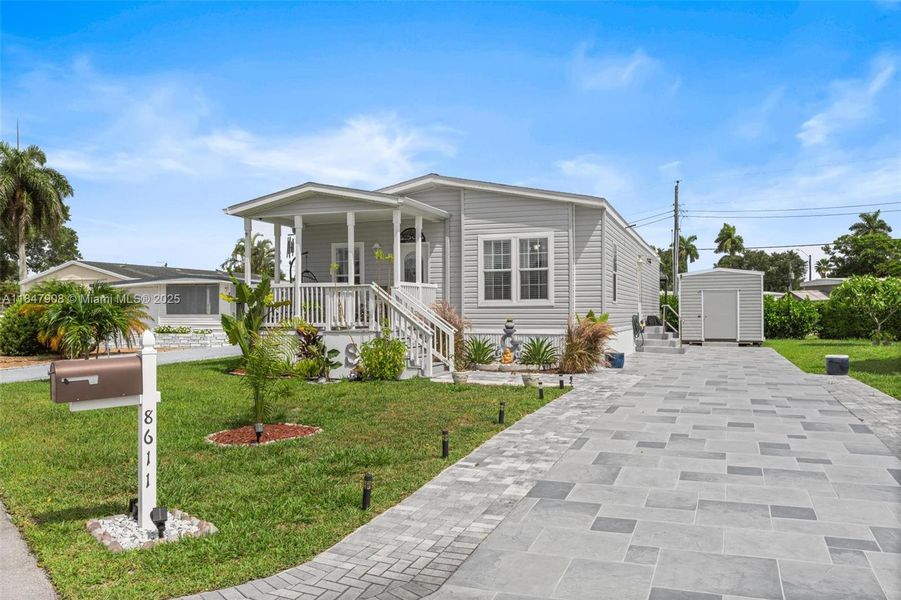 Front exterior of a new home in , Davie, FL, highlighting curb appeal (Image 21).