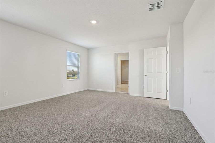 Spacious, unfurnished interior of a new home in Lake Deer Estates - Signature Series, Poinciana (Image 29).