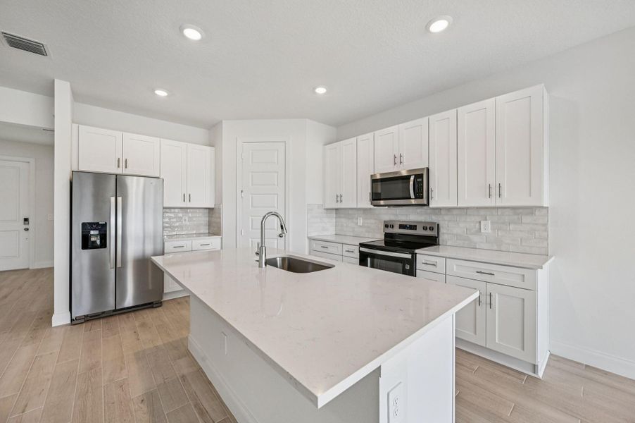 Furnished interior view inside a new home in Brystol at Wylder - Reserve Series, Port St. Lucie (Image 13).