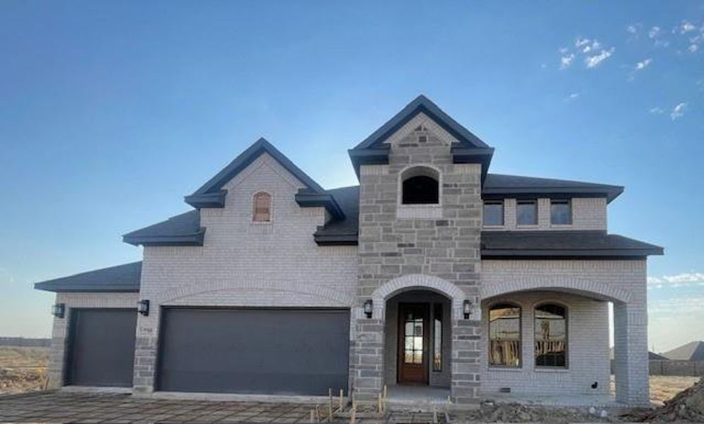 French country style house with a garage