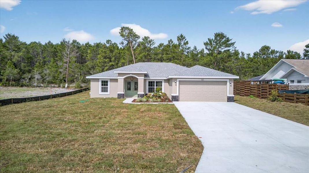 Front exterior of a new home in , Spring Hill, FL, highlighting curb appeal (Image 20).