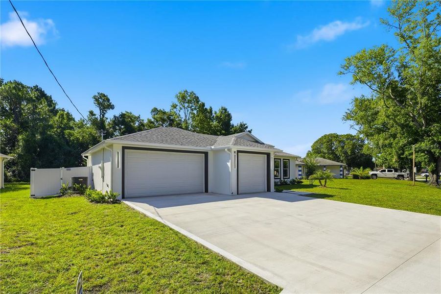 Front exterior of a new home in , Palm Coast, FL, highlighting curb appeal (Image 1). Front exterior of a new home in , Palm Coast, FL, highlighting curb appeal (Image 1).