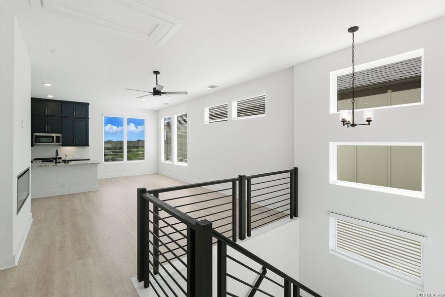 Furnished interior view inside a new home in Centero at Stone Oak, San Antonio (Image 13).