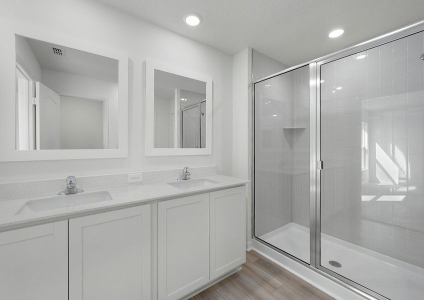 A dual sink vanity in the master bathroom