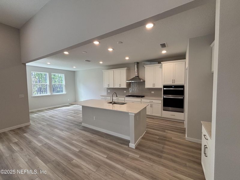 Furnished interior view inside a new home in The Cypress Series at Reserve East, Flagler Beach (Image 4).