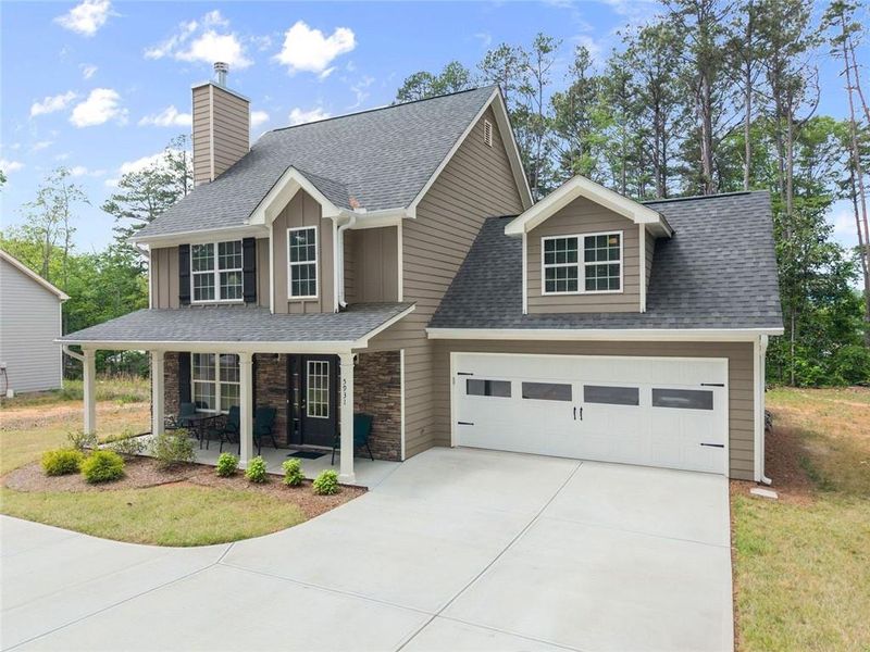 Front exterior of a new home in , Clermont, GA, highlighting curb appeal (Image 22).