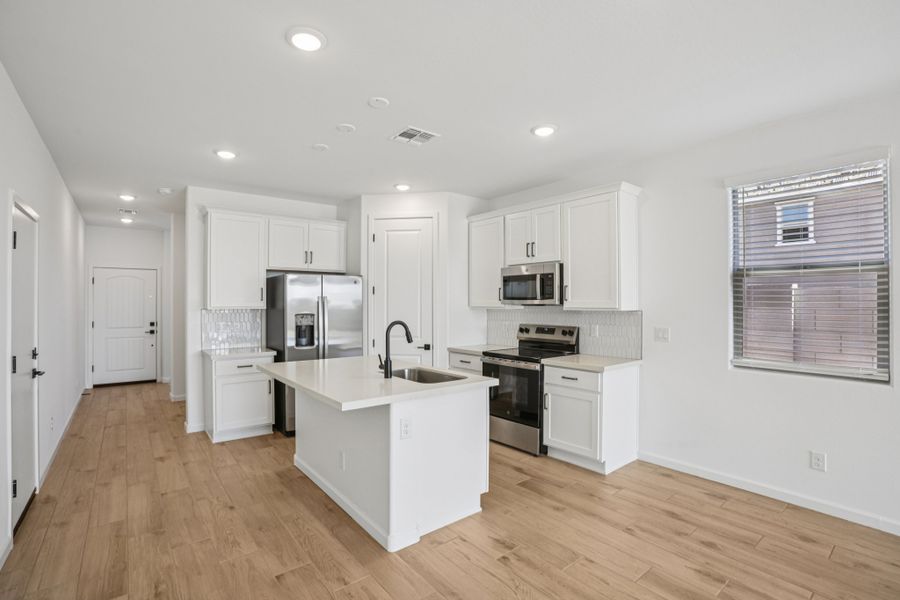 Kitchen featuring the Harmony Collection. Finishes and options may vary by community.
