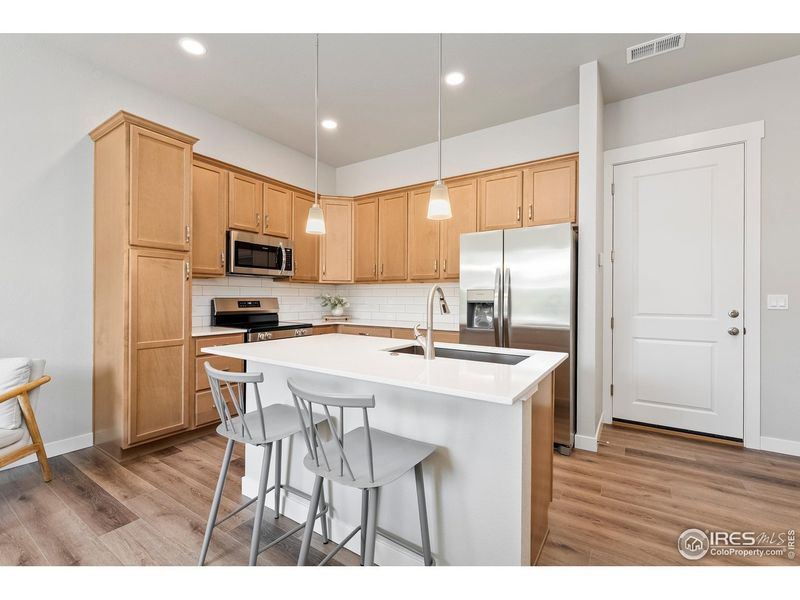Furnished interior view inside a new home in The Lakes at Centerra - Discovery, Loveland (Image 8).