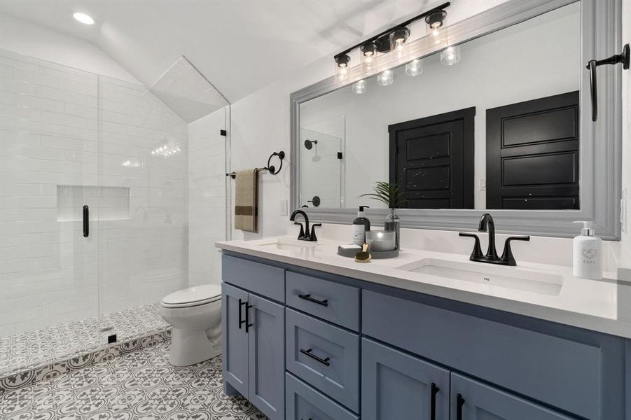 MORE sinks, more storage, and a beautiful tiled walk-in shower with frameless glass surround. *Virtually staged.