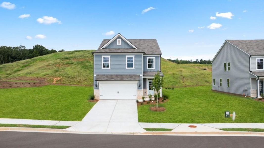 Front exterior of a new home in Sheffield Highlands, Dallas, GA, highlighting curb appeal (Image 23). Front exterior of a new home in Sheffield Highlands, Dallas, GA, highlighting curb appeal (Image 23).
