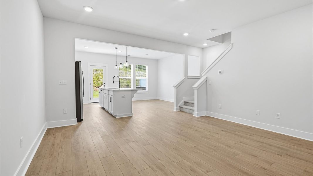 Memorable moments begin in this elegant, open family room with hardwood flooring and refined finishes Memorable moments begin in this elegant, open family room with hardwood flooring and refined finishes
