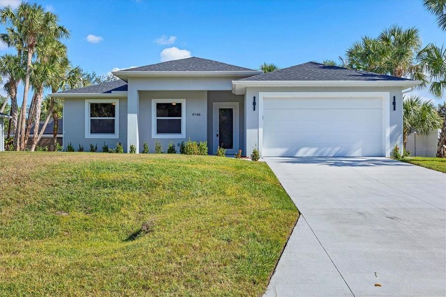 Front exterior of a new home in , North Port, FL, highlighting curb appeal (Image 1). Front exterior of a new home in , North Port, FL, highlighting curb appeal (Image 1).