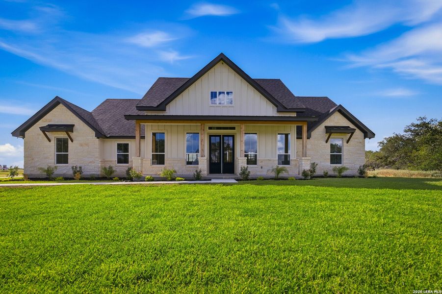 Front exterior of a new home in , Floresville, TX, highlighting curb appeal (Image 2). Front exterior of a new home in , Floresville, TX, highlighting curb appeal (Image 2).