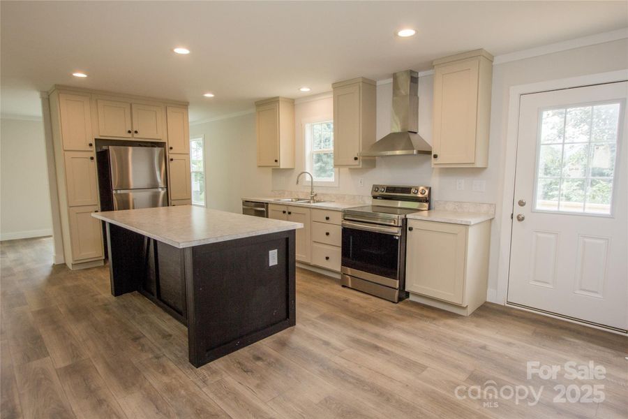 Kitchen w/ door to side deck