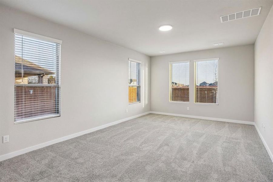 Primary Suite in the Wimbledon home plan by Trophy Signature Homes – REPRESENTATIVE PHOTO