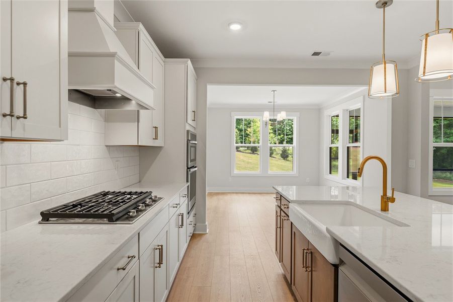 An inviting kitchen with a gas cooktop, double ove