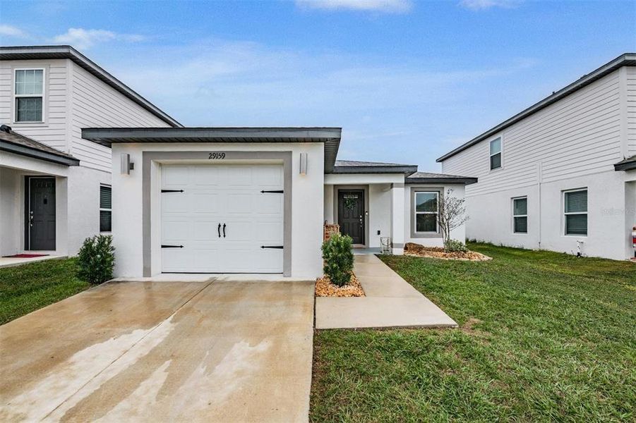 Exterior details and patio area of a home in Trilby Crossing, Brooksville (Image 22).