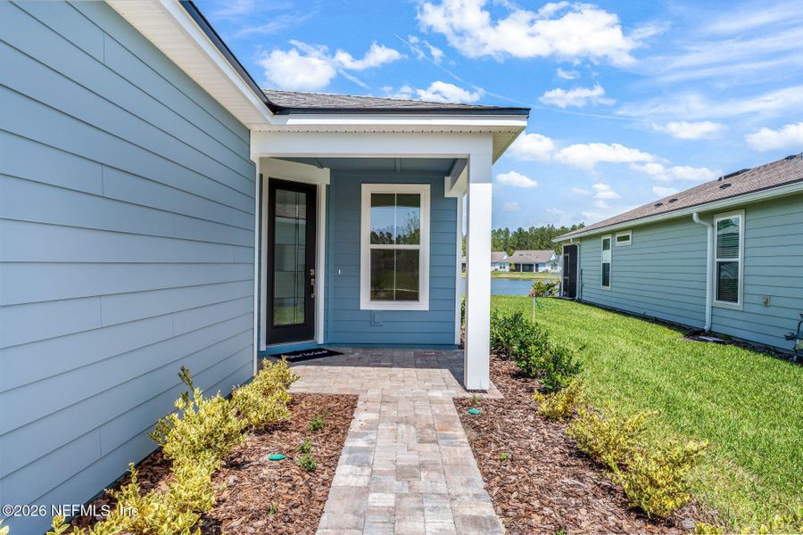 Exterior details and patio area of a home in Del Webb Wildlight, Wildlight (Image 29).