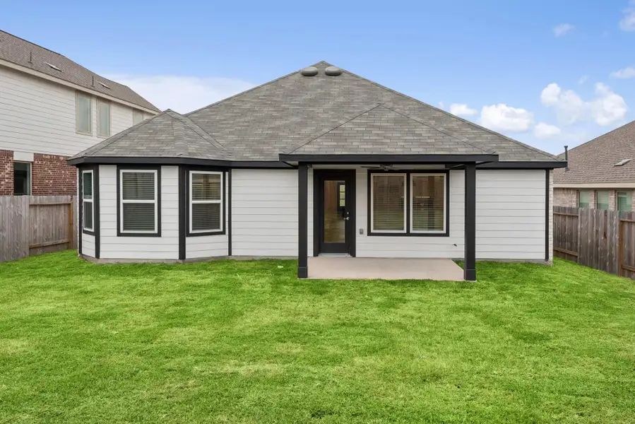 Exterior details and patio area of a home in Magnolia Ridge, Magnolia (Image 4).