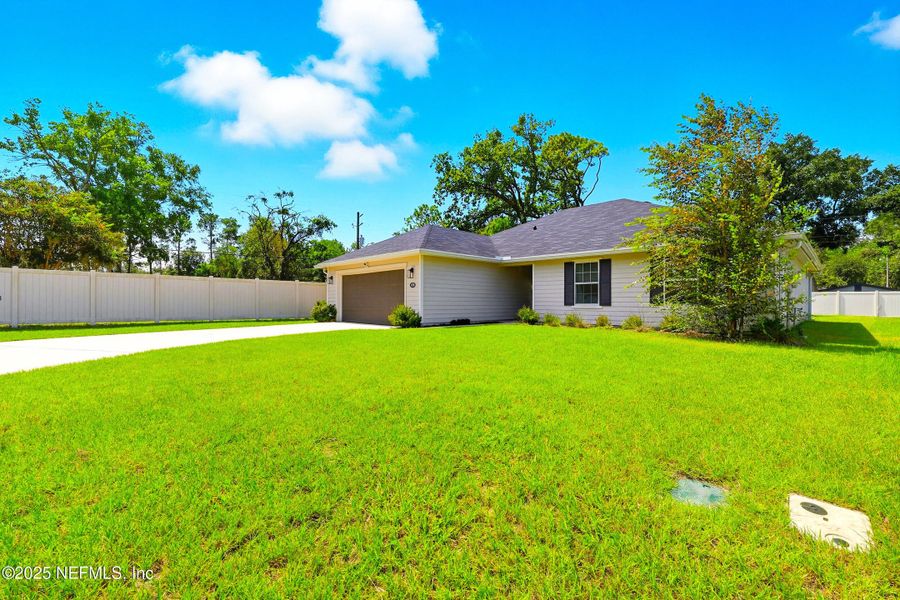 Front exterior of a new home in , Jacksonville, FL, highlighting curb appeal (Image 2).