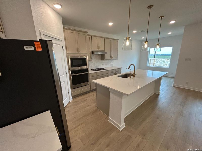 Furnished interior view inside a new home in Hennersby Hollow, San Antonio (Image 13).
