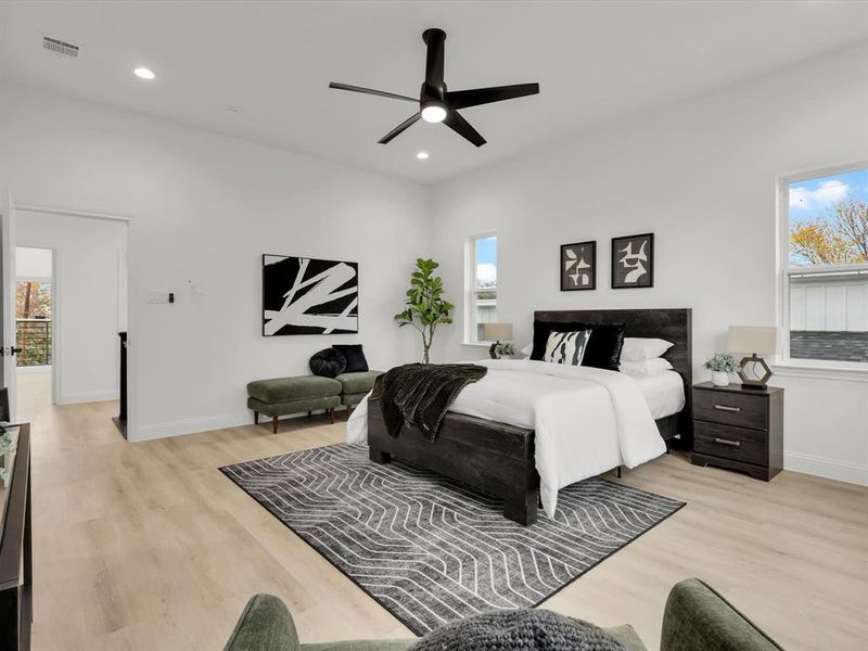 Bedroom with ceiling fan and light hardwood / wood-style floors