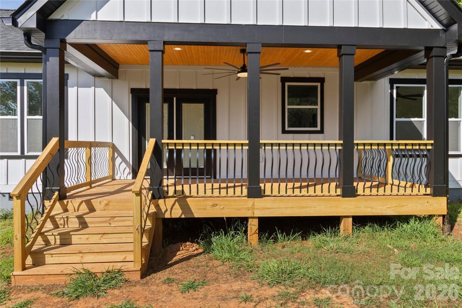 Rear deck with 72" ceiling fan and wooden ceilings. This is an uograded over size deck.