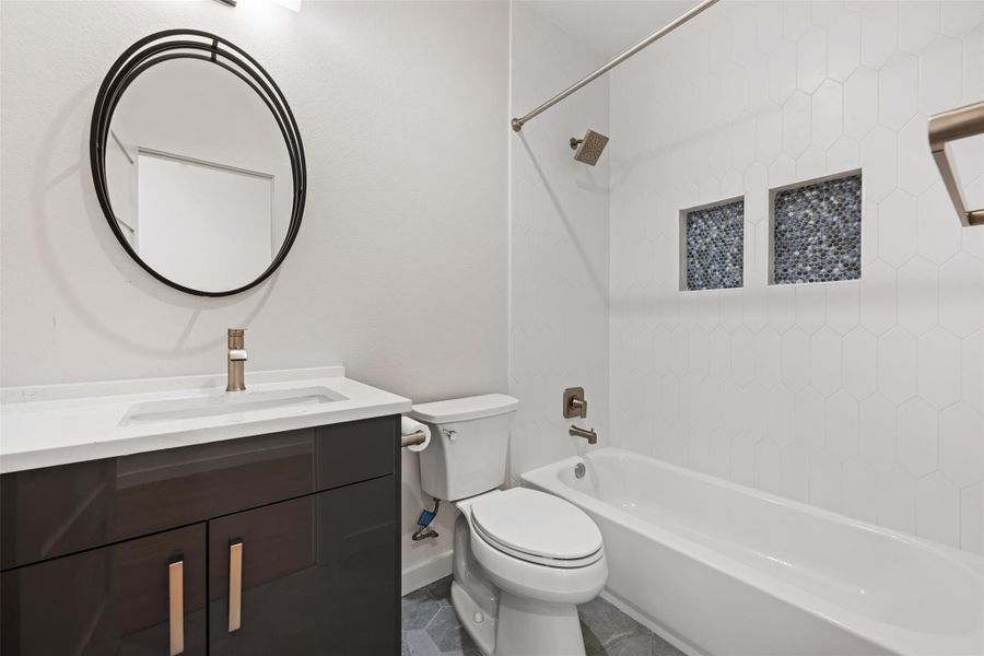 Full bathroom with  shower combination, vanity, and tile patterned flooring