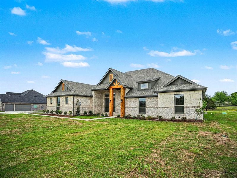Front exterior of a new home in Sagebrush Addition, Midlothian, TX, highlighting curb appeal (Image 21). Front exterior of a new home in Sagebrush Addition, Midlothian, TX, highlighting curb appeal (Image 21).